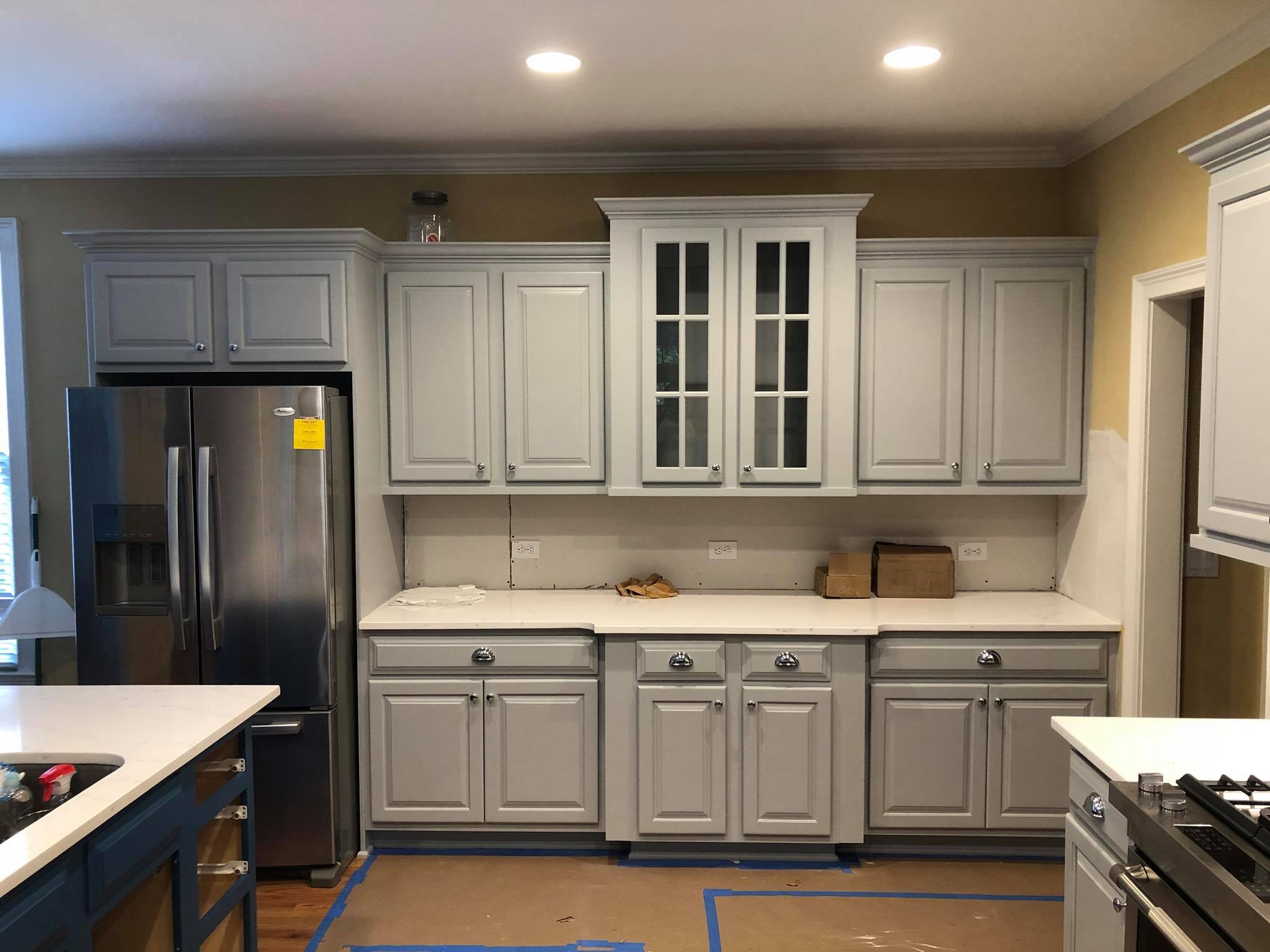 Full Kitchen Remodeling with Upper and Lower Cabinets Painted White Front View
