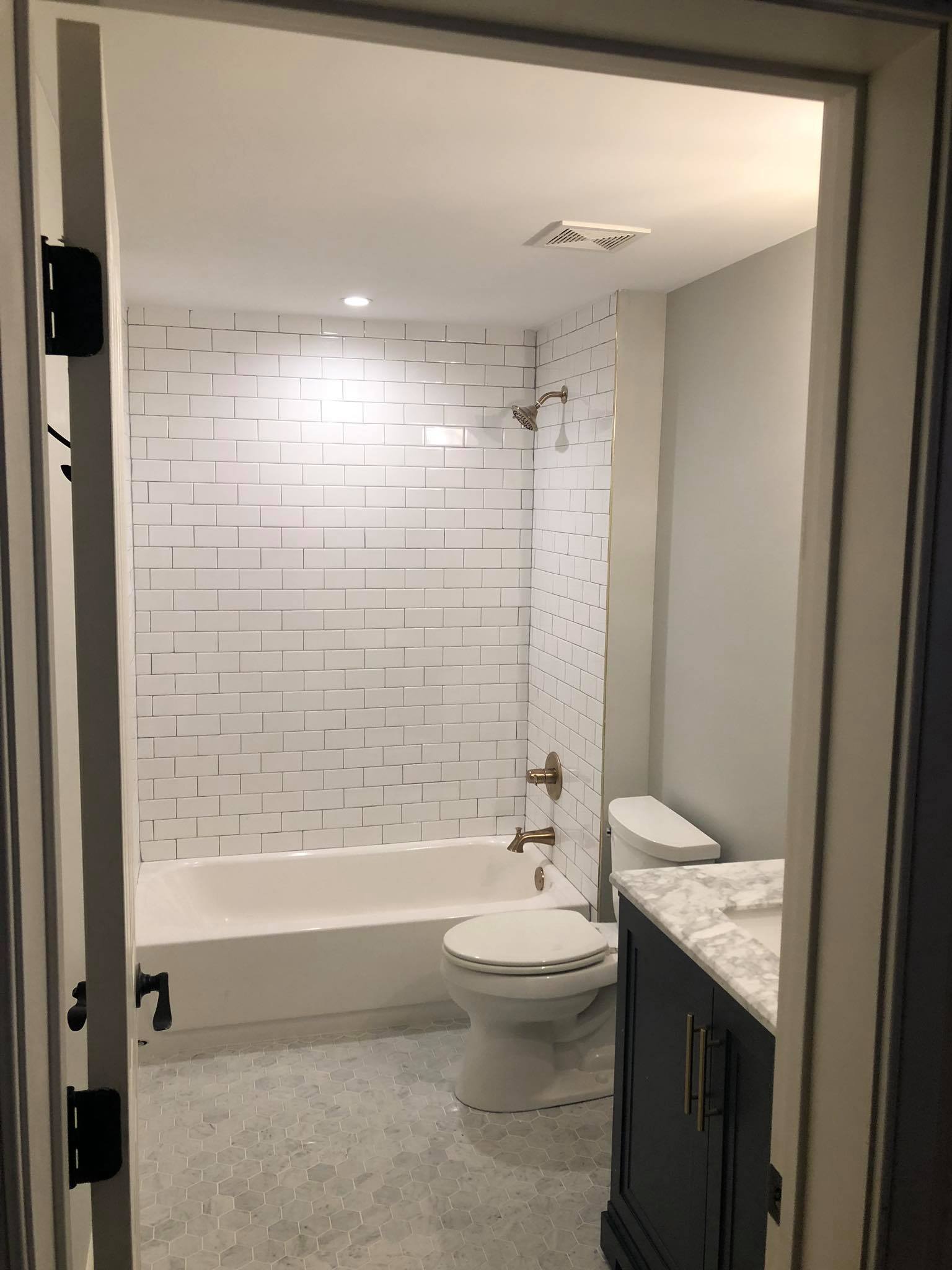 Bathroom Remodel with New Tiles and Double Door Vanity Far View