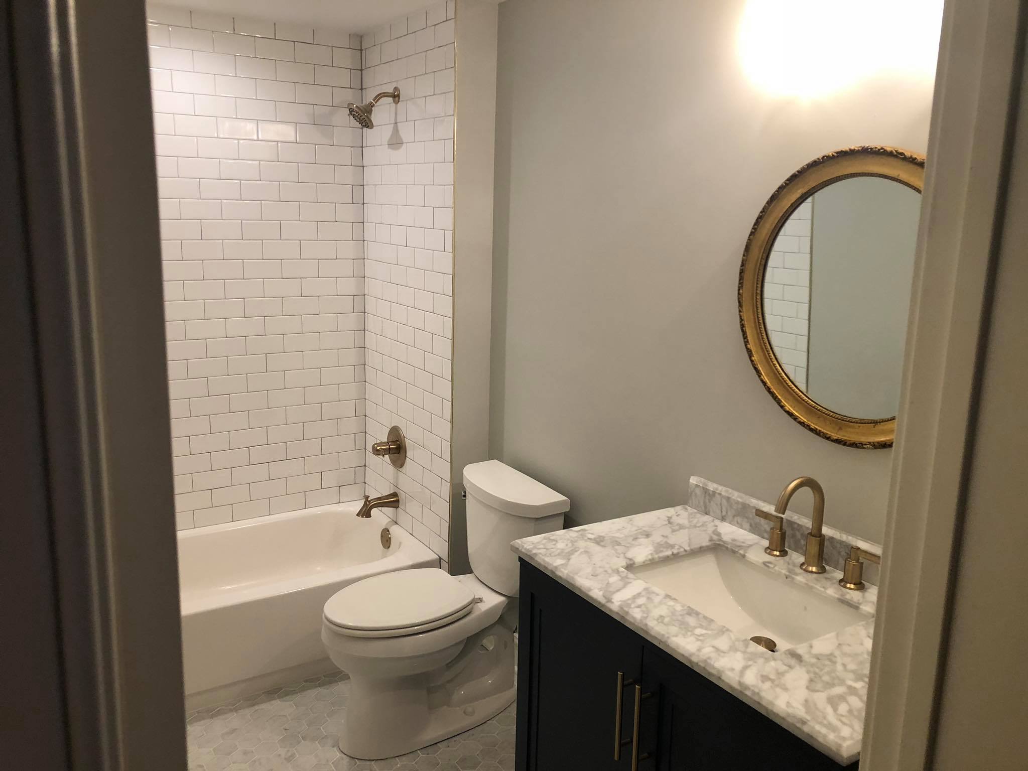 Bathroom Remodel with New Tiles and Double Door Vanity