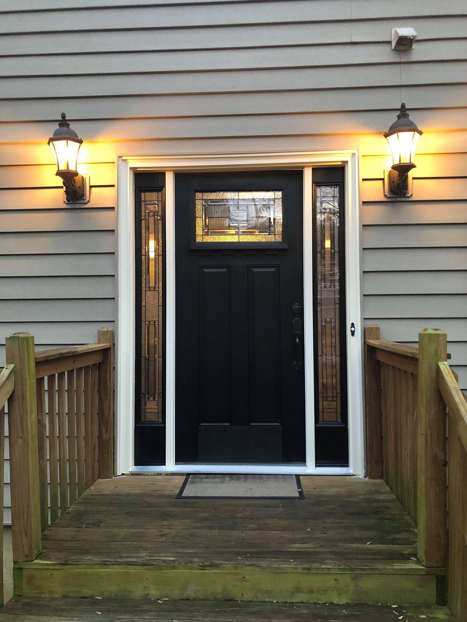 Front Door Installation with Glass and Side Trim Painted Black