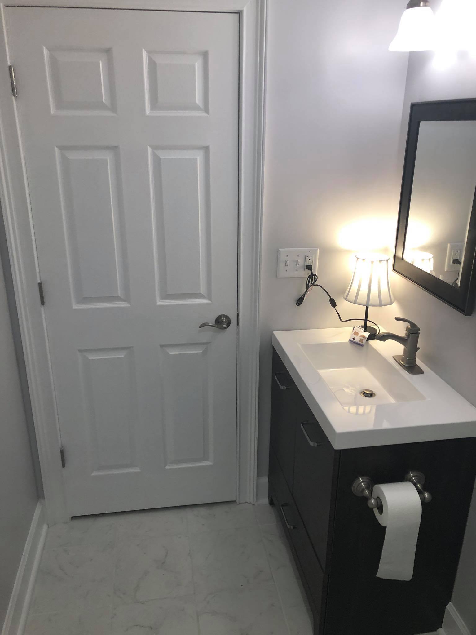 Completed Basement Bathroom Build and Installation with Vanity Tub and Shower 2