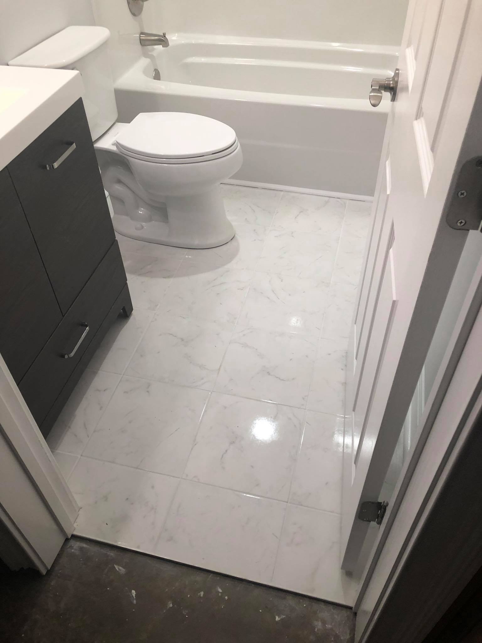 Completed Basement Bathroom Build and Installation with Vanity Tub and Shower