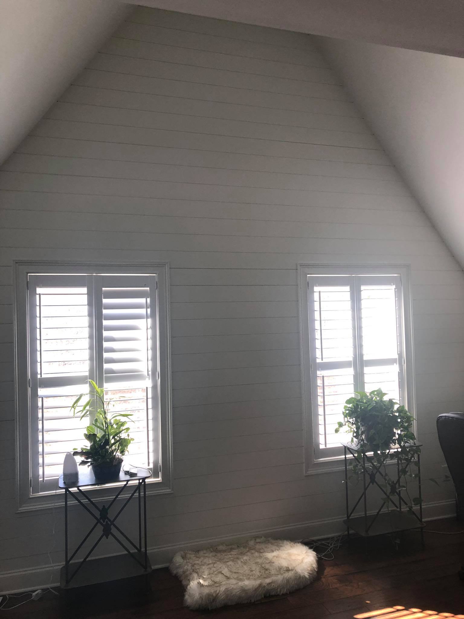 Shiplap On Walls Painted White with Hardwood Floor Installed