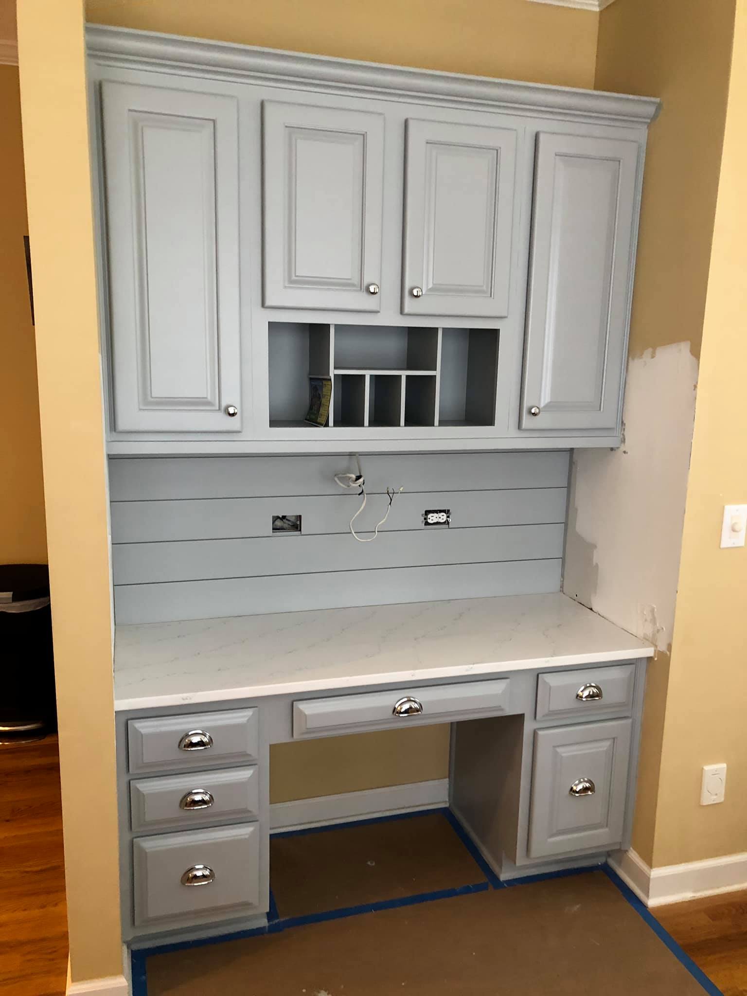 Custom Wall Mounted Cabinets with Slots and Shiplap Walls and Desk with Drawers