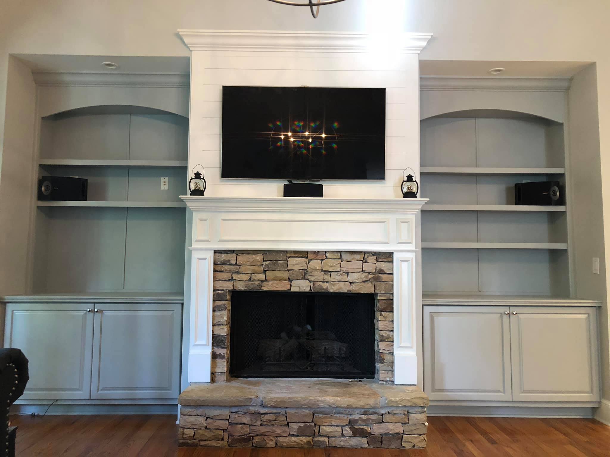 Fireplace with Mantel and Wall High Built in Cabinets with Double Doors Painted Grey 4