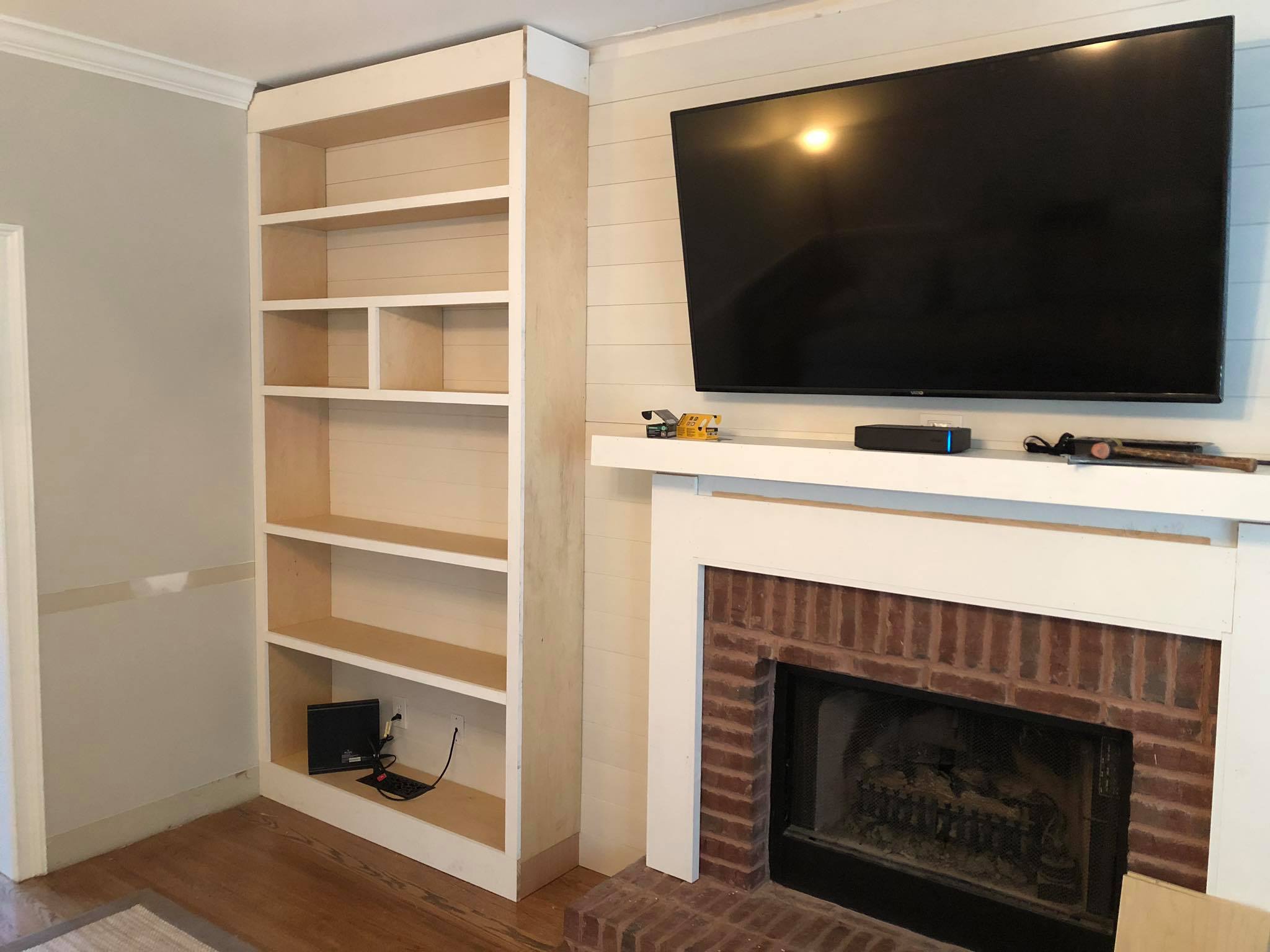 Fireplace Custom Wall High Built in Cabinets Shelves and Trim Painted White Installing 3