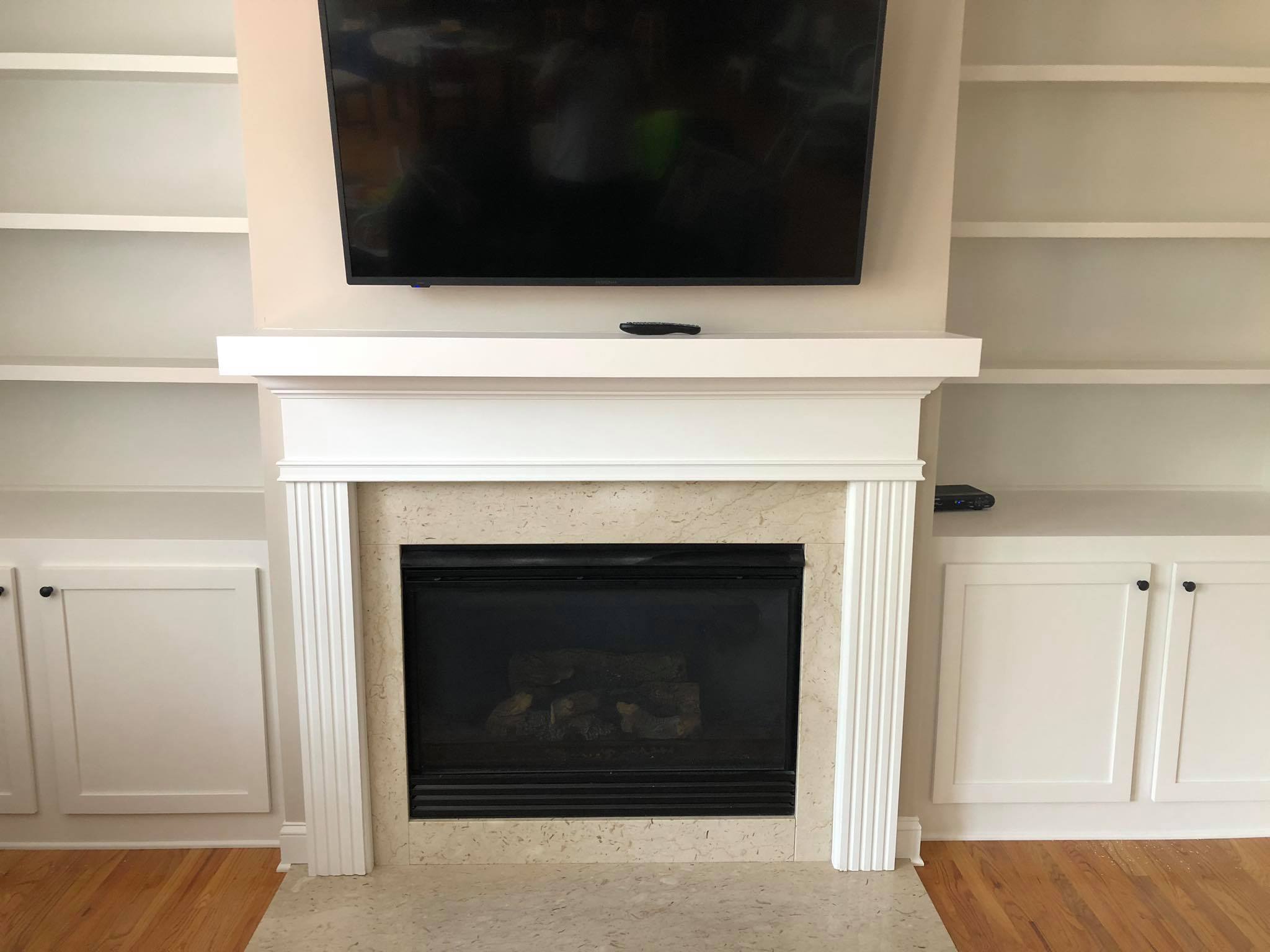 Fireplace Entertainment Center with Floating Shelves and Double Door Cabinets Front
