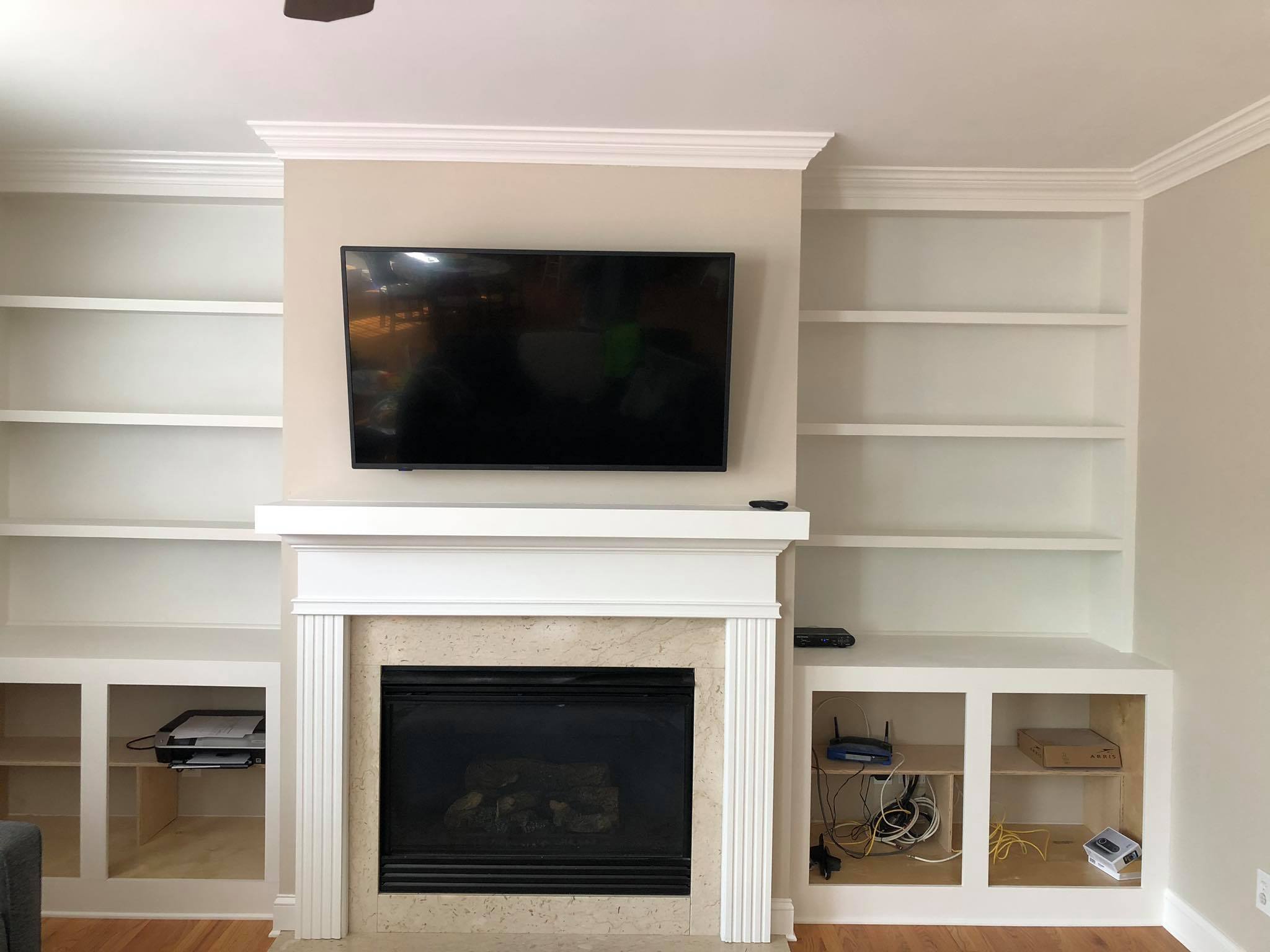 Fireplace Entertainment Center with Floating Shelves and Double Door Cabinets Front View