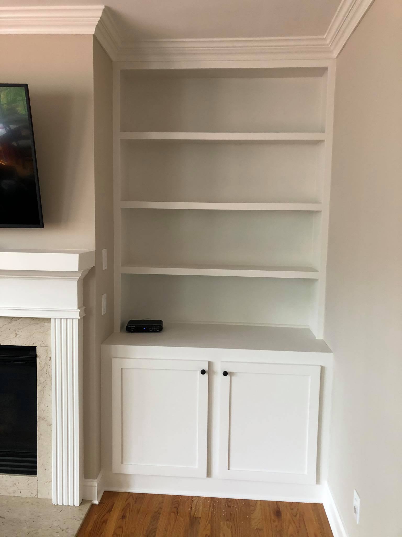 Fireplace Entertainment Center with Floating Shelves and Double Door Cabinets Side View