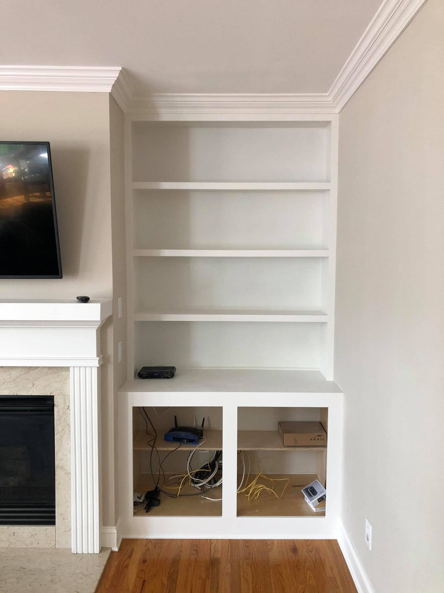 Fireplace Entertainment Center with Floating Shelves and Double Door Cabinets Front View 3