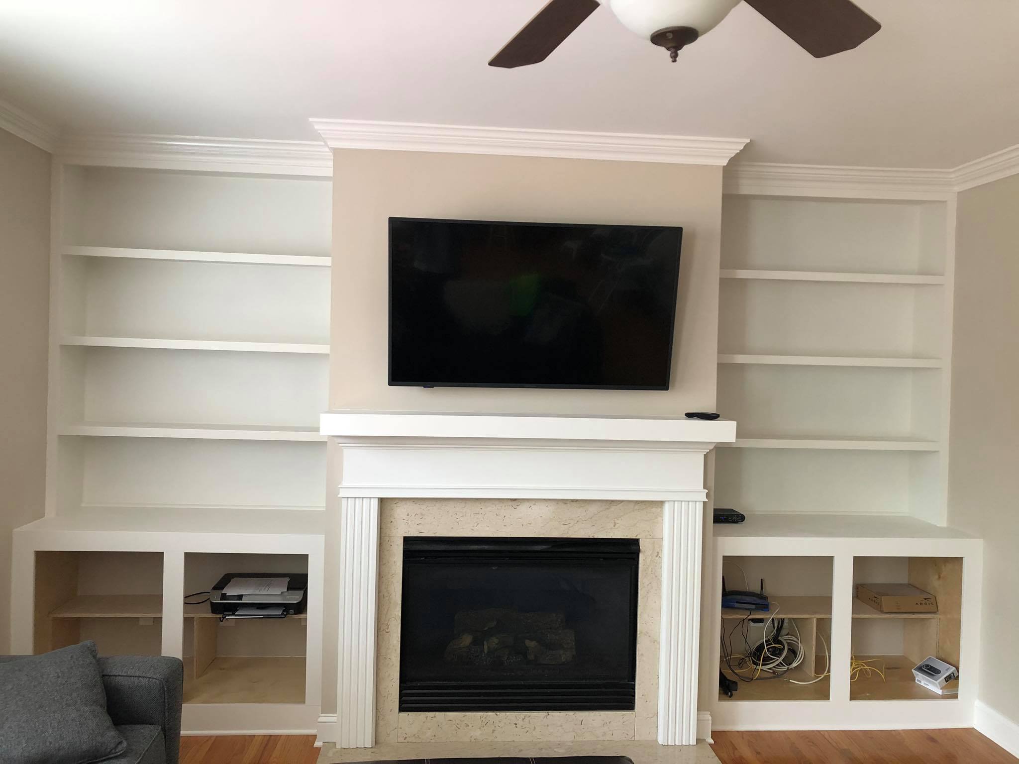Fireplace Entertainment Center with Floating Shelves and Double Door Cabinets Front View