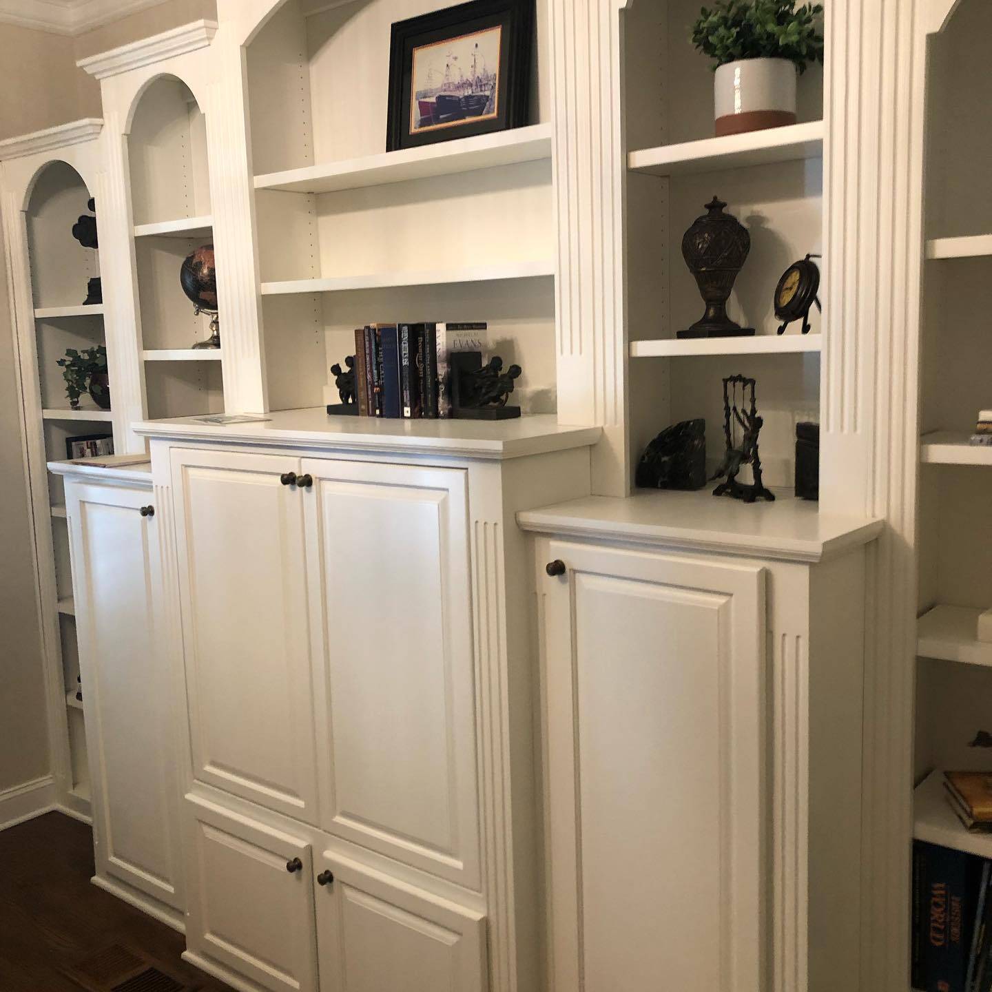 Fireplace Built in Shelves and Painting with Double Door Cabinet Base White