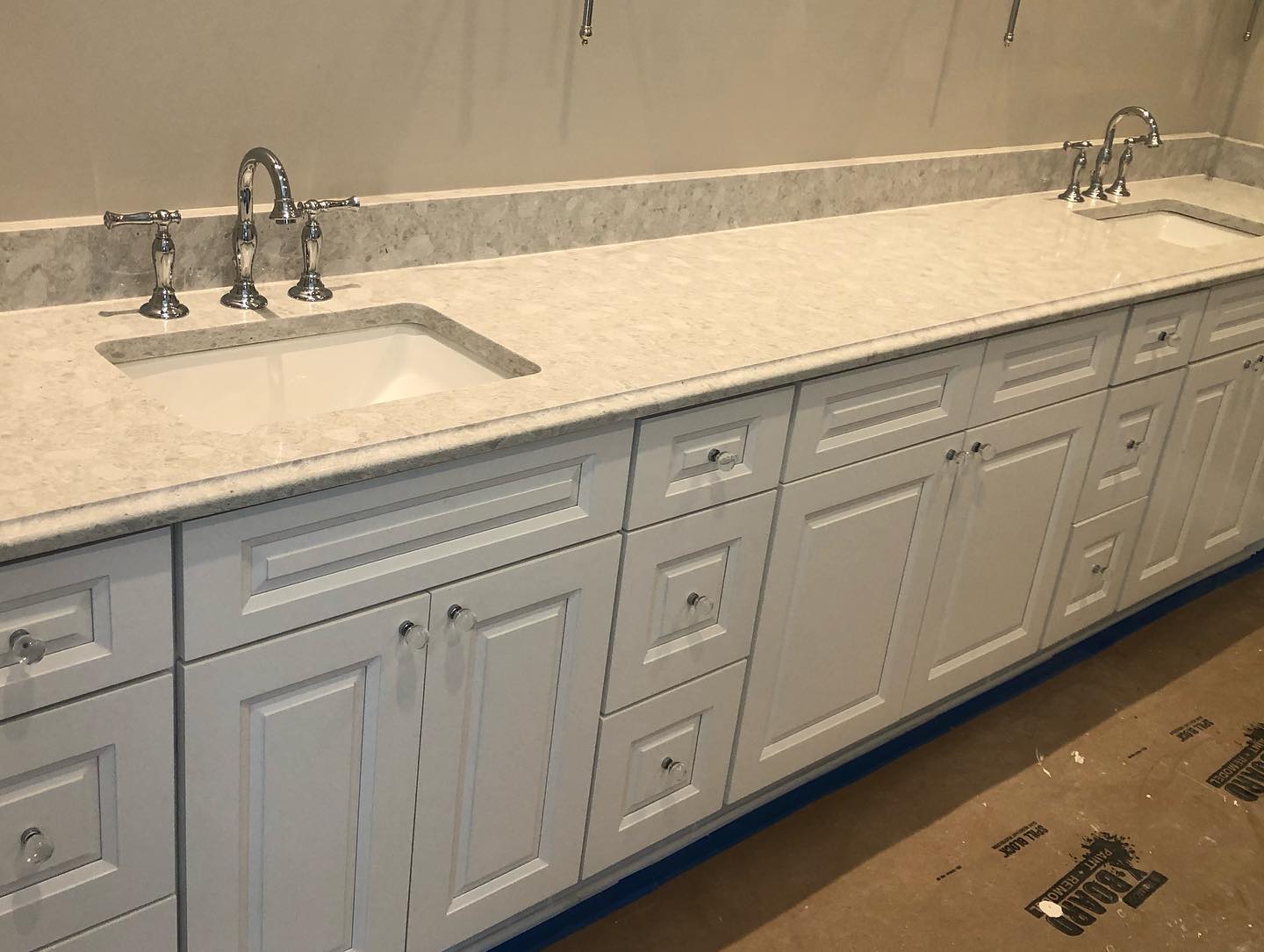 White Bathroom Vanities with Custom Knobs and Double Sink Side Wide View
