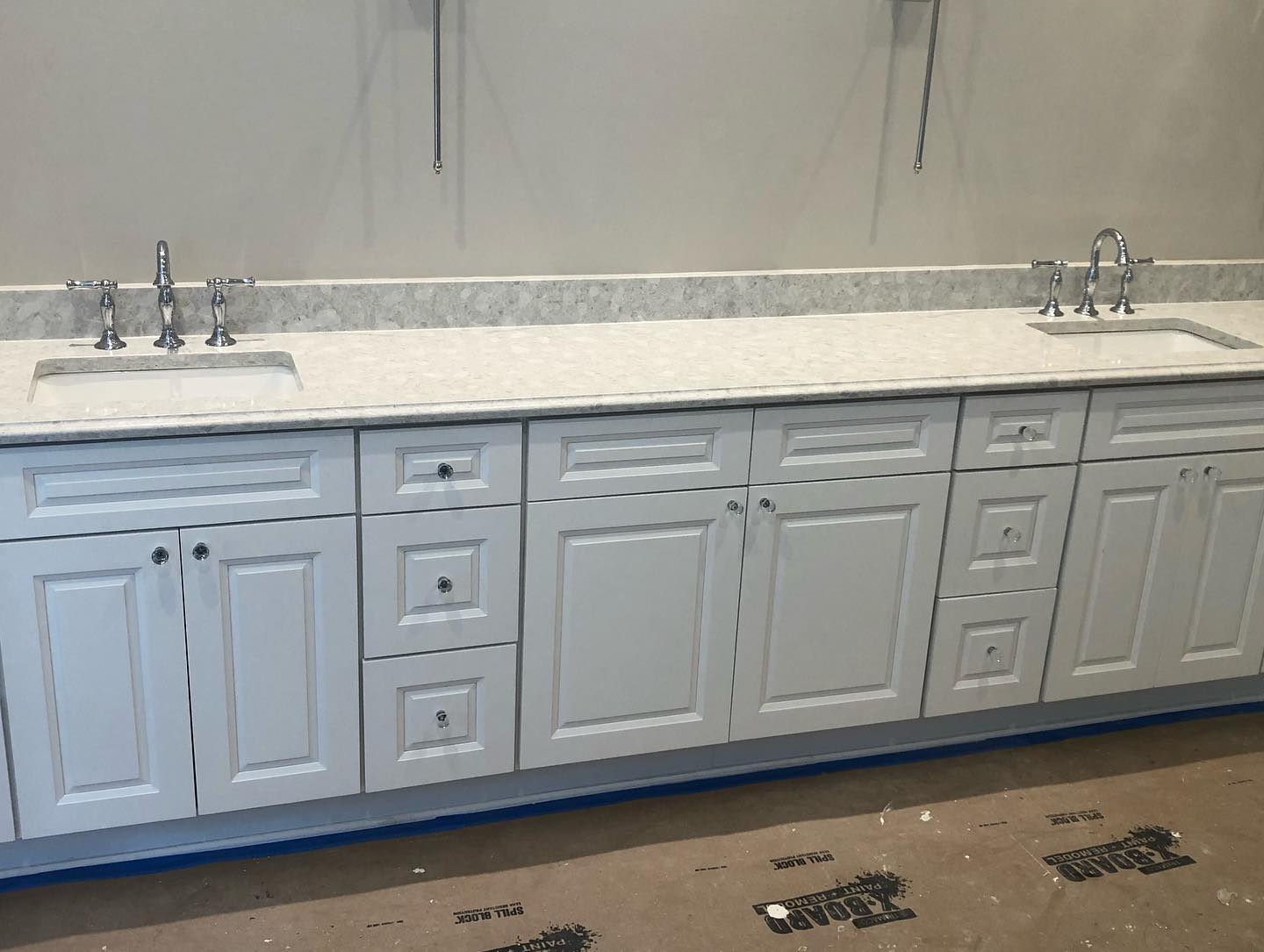 White Bathroom Vanities with Custom Knobs and Double Sink Wide View