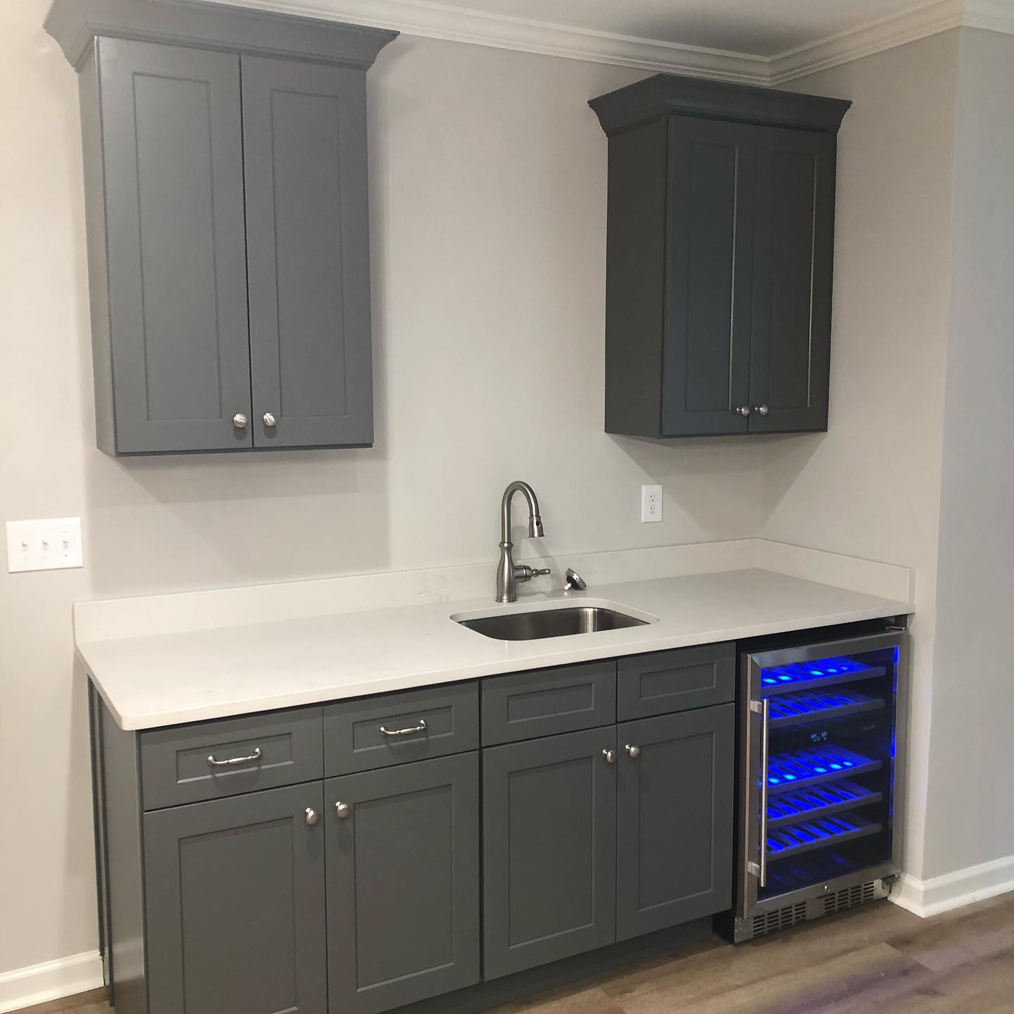 Custom Basement Bar with Wall Mounted Cabinets and Single Sink Double Door Base Cabinets 2
