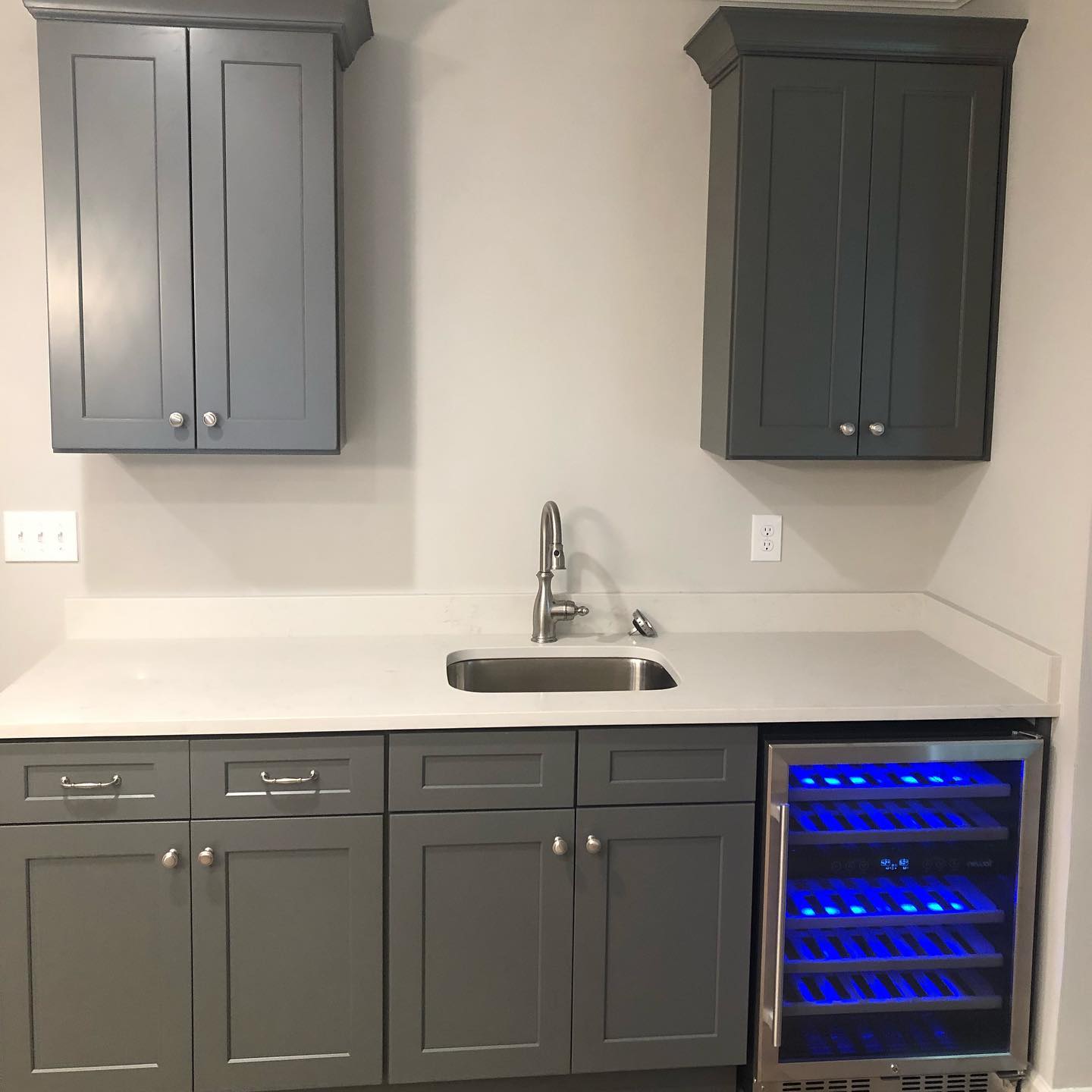 Custom Basement Bar with Wall Mounted Cabinets and Single Sink Double Door Base Cabinets 1