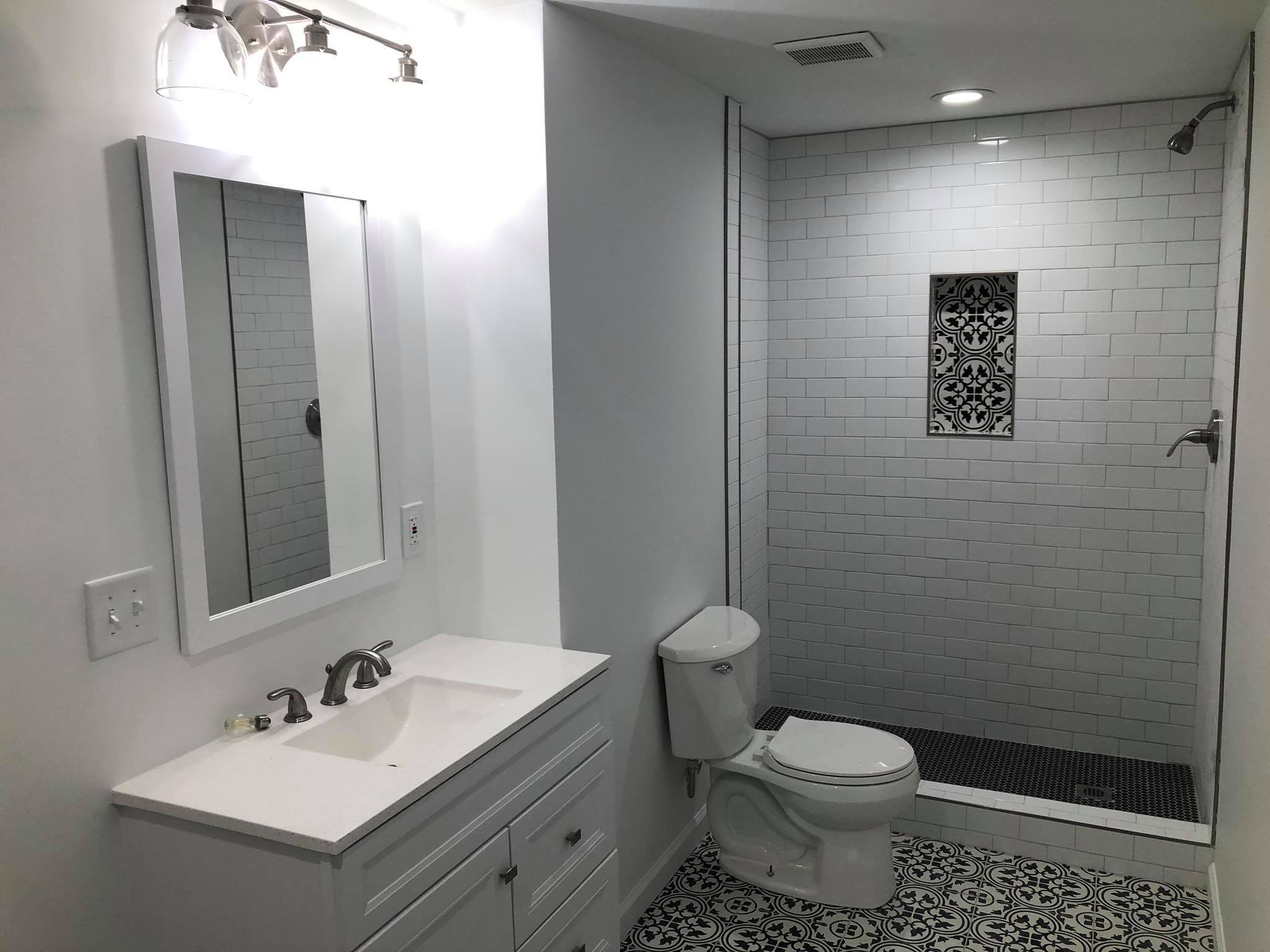 Basement Bathroom Built-in Bench Shiplap & Shelf with Custom Tile Shower and Floors