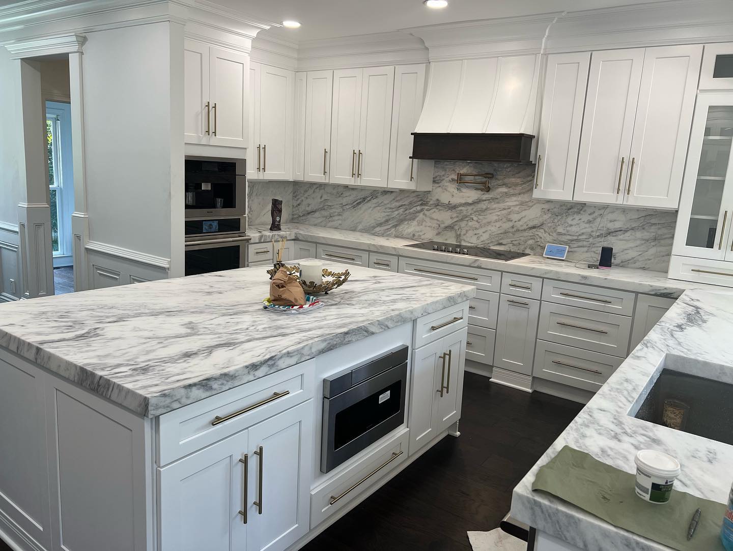 Shaker White Kitchen Cabinets Installation Crown Molding and Custom Handles